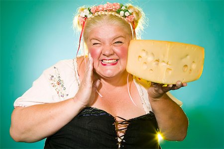 fat giant people - Germanic woman posing with cheese wedge Stock Photo - Premium Royalty-Free, Code: 673-02140480