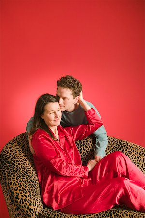 Affectionate couple on leopard print couch Stock Photo - Premium Royalty-Free, Code: 673-02140568