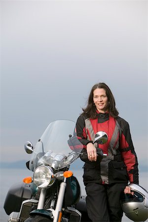 Woman posing with motorcycle Stock Photo - Premium Royalty-Free, Code: 673-02140599