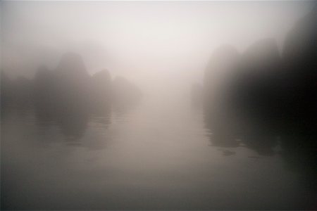 Rocks and water through mist at dawn Stock Photo - Premium Royalty-Free, Code: 673-02140678
