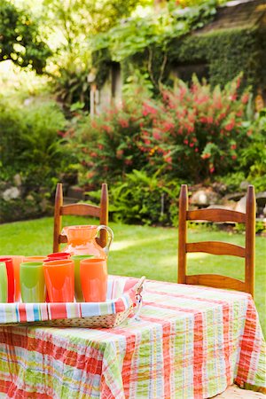Table and chairs in garden with beverages Stock Photo - Premium Royalty-Free, Code: 673-02140748