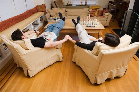 Couple relaxing at home in living room Stock Photo - Premium Royalty-Free, Code: 673-02140794