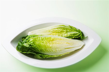 romaine - Romaine lettuce in curved dish Stock Photo - Premium Royalty-Free, Code: 673-02140829