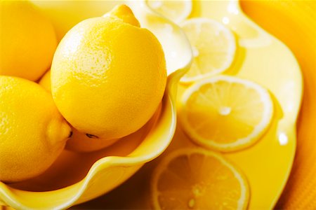 Closeup of lemons and lemon slices Stock Photo - Premium Royalty-Free, Code: 673-02140835