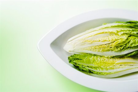 romaine lettuce leaf - Romaine lettuce in curved dish Stock Photo - Premium Royalty-Free, Code: 673-02140830