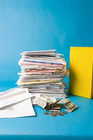 Stack of paperwork and money Stock Photo - Premium Royalty-Free, Code: 673-02140865