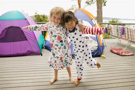 friendship wood - Girls in pajamas with tents on balcony Stock Photo - Premium Royalty-Free, Code: 673-02140898