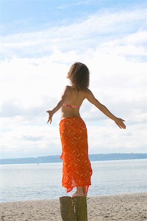 simsearch:673-02140392,k - Woman basking in sun on beach Stock Photo - Premium Royalty-Free, Code: 673-02140922