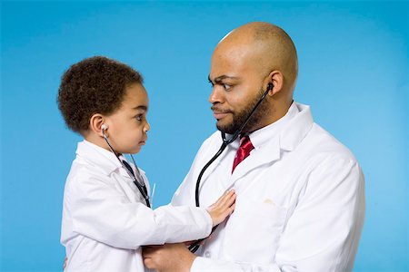 Profile of young boy with male doctor Foto de stock - Sin royalties Premium, Código: 673-02140976