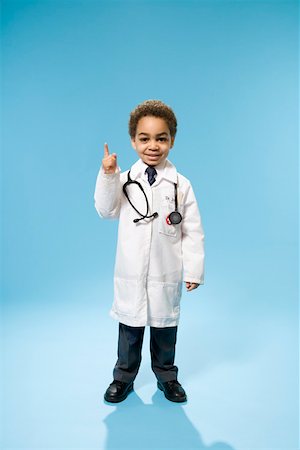 funny wellness healthcare - Portrait of young boy dressed as doctor Stock Photo - Premium Royalty-Free, Code: 673-02140984