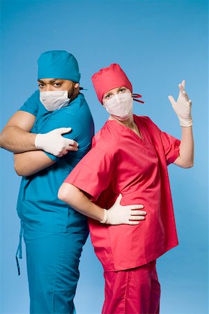 rubber gloves lady surgeon - Portrait of two doctors standing back to back Stock Photo - Premium Royalty-Free, Code: 673-02141014