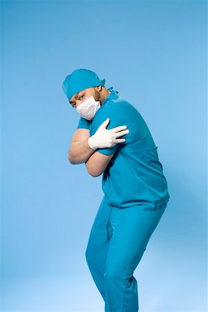 doctor with cap and mask - Portrait of doctor wearing scrubs Stock Photo - Premium Royalty-Free, Code: 673-02141015