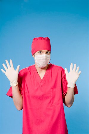 rubber gloves lady surgeon - Female doctor wearing scrubs Stock Photo - Premium Royalty-Free, Code: 673-02141010