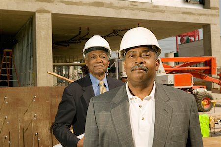 smiling elderly black man - Portrait of businessmen at construction site Stock Photo - Premium Royalty-Free, Code: 673-02141104