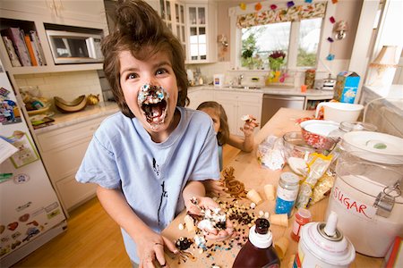 Portrait of boy with food on face Stock Photo - Premium Royalty-Free, Code: 673-02141216