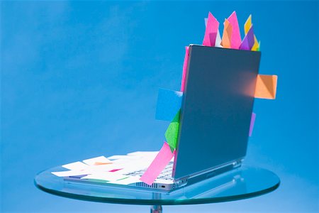 Laptop with sticky notes stuck to it Stock Photo - Premium Royalty-Free, Code: 673-02141253