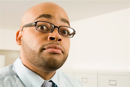 Close up portrait of businessman wearing glasses Stock Photo - Premium Royalty-Free, Code: 673-02141325