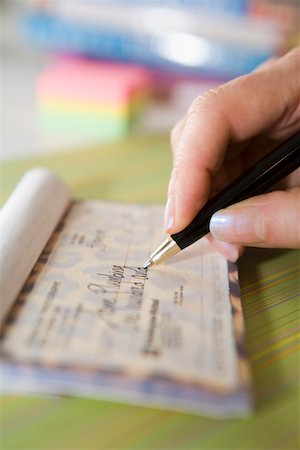 reserva - Hand writing check Foto de stock - Sin royalties Premium, Código: 673-02141342