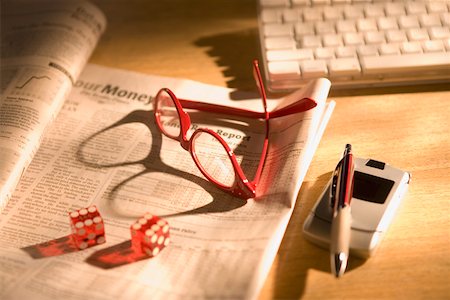 risk finance - Glasses and dice with newspaper Stock Photo - Premium Royalty-Free, Code: 673-02141355