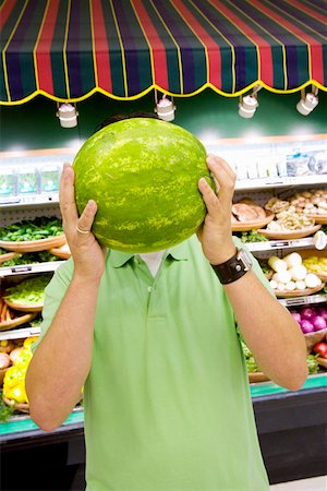 Man holding watermelon in supermarket Stock Photo - Premium Royalty-Free, Code: 673-02141520