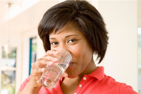 Woman drinking a glass of water Stock Photo - Premium Royalty-Free, Code: 673-02141723