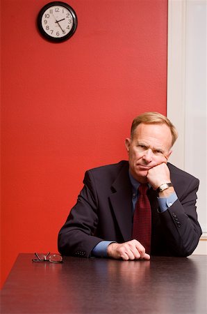 Businessman waiting alone at conference table Stock Photo - Premium Royalty-Free, Code: 673-02141763