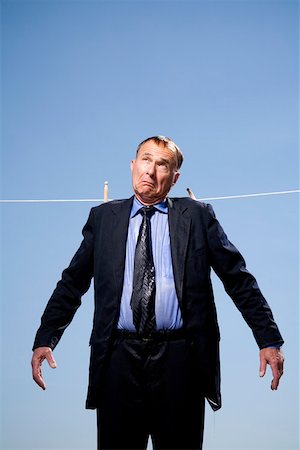 suit gentleman - Businessman hung out to dry Stock Photo - Premium Royalty-Free, Code: 673-02141780