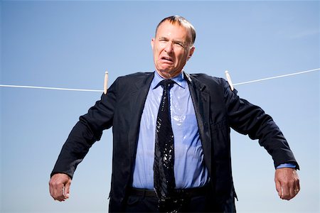 suit gentleman - Businessman hung out to dry Stock Photo - Premium Royalty-Free, Code: 673-02141781