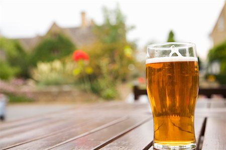 pub exterior - Pint of beer on outdoor pub table Cotswolds, United Kingdom Stock Photo - Premium Royalty-Free, Code: 673-02141848