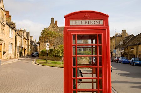 Red telephone booth in town, Cotswolds, United Kingdom Stock Photo - Premium Royalty-Free, Code: 673-02141854