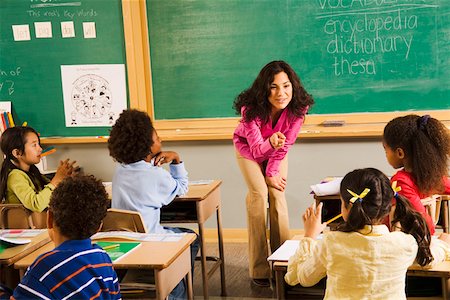 pedir ajuda - Female teacher asking student a question Foto de stock - Royalty Free Premium, Número: 673-02141929