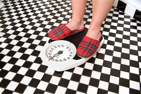 feet, scale - Close up of person standing on bathroom scale Stock Photo - Premium Royalty-Free, Code: 673-02142140