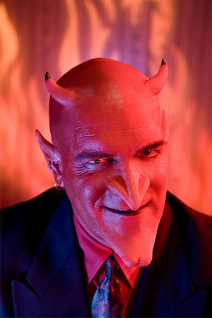 Close up of businessman dressed as devil Foto de stock - Sin royalties Premium, Código: 673-02142163