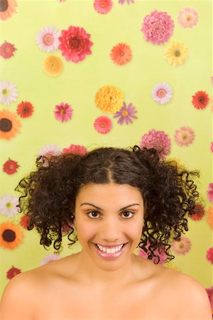 simsearch:673-02142187,k - Portrait of woman in front of flower background Stock Photo - Premium Royalty-Free, Code: 673-02142187