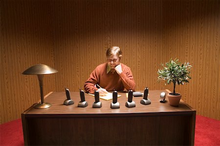 furniture salesperson - Businessman at desk with multiple telephones Stock Photo - Premium Royalty-Free, Code: 673-02142310