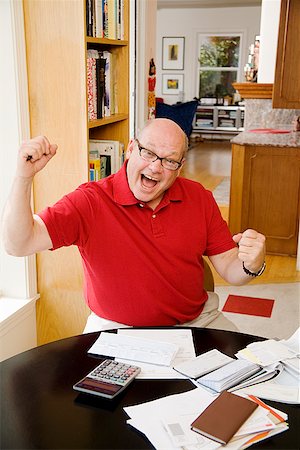 fat bald man with glasses - Man celebrating after paying bills Stock Photo - Premium Royalty-Free, Code: 673-02142504
