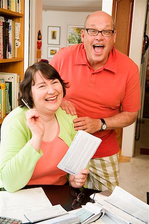 fat funny mans - Couple paying bills Stock Photo - Premium Royalty-Free, Code: 673-02142518