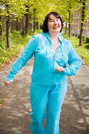 fat woman walking - Woman power walking outdoors Stock Photo - Premium Royalty-Free, Code: 673-02142549