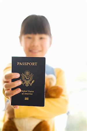 passport - Young girl holding teddy bear and passport Stock Photo - Premium Royalty-Free, Code: 673-02142789