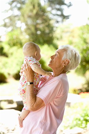 Senior woman holding baby Stock Photo - Premium Royalty-Free, Code: 673-02142896