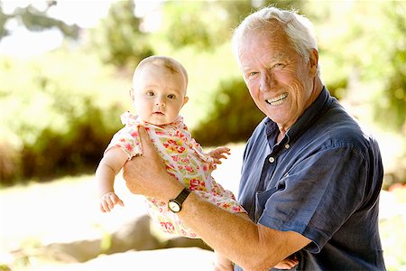 elderly man family care - Senior man holding baby Stock Photo - Premium Royalty-Free, Code: 673-02142899