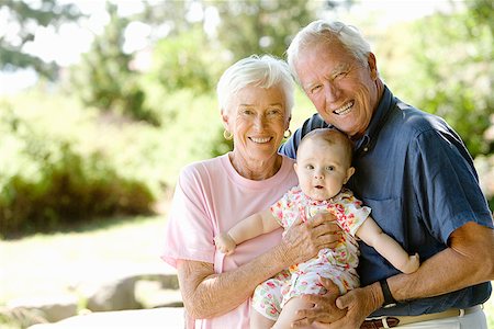 elderly man family care - Senior couple holding baby Stock Photo - Premium Royalty-Free, Code: 673-02142893