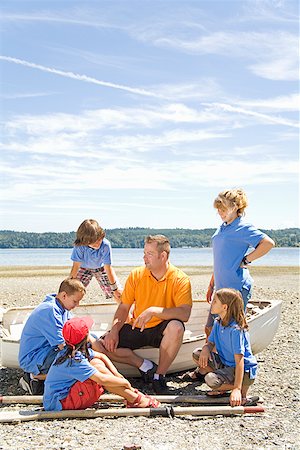 Male camp counselor and children at beach Stock Photo - Premium Royalty-Free, Code: 673-02142932