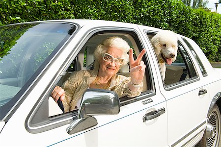 street woman retro - Senior woman and dog in car Stock Photo - Premium Royalty-Free, Code: 673-02143207