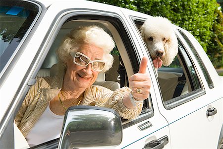 street woman retro - Senior woman and dog in car Stock Photo - Premium Royalty-Free, Code: 673-02143208