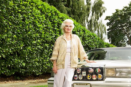 fashion for 70 year old woman - Senior woman leaning on car Stock Photo - Premium Royalty-Free, Code: 673-02143219