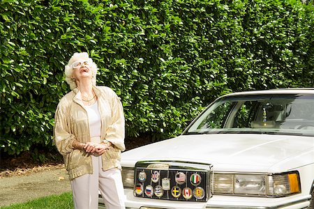 fashion photography elderly women - Senior woman laughing next to car Stock Photo - Premium Royalty-Free, Code: 673-02143220