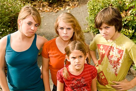 Group of siblings making faces Stock Photo - Premium Royalty-Free, Code: 673-02143594