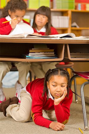 punishment girls - African girl sitting under school desk Stock Photo - Premium Royalty-Free, Code: 673-02143655