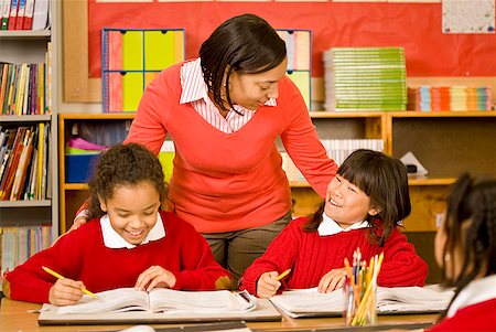 simsearch:673-02143704,k - African female teacher talking to students Stock Photo - Premium Royalty-Free, Code: 673-02143693